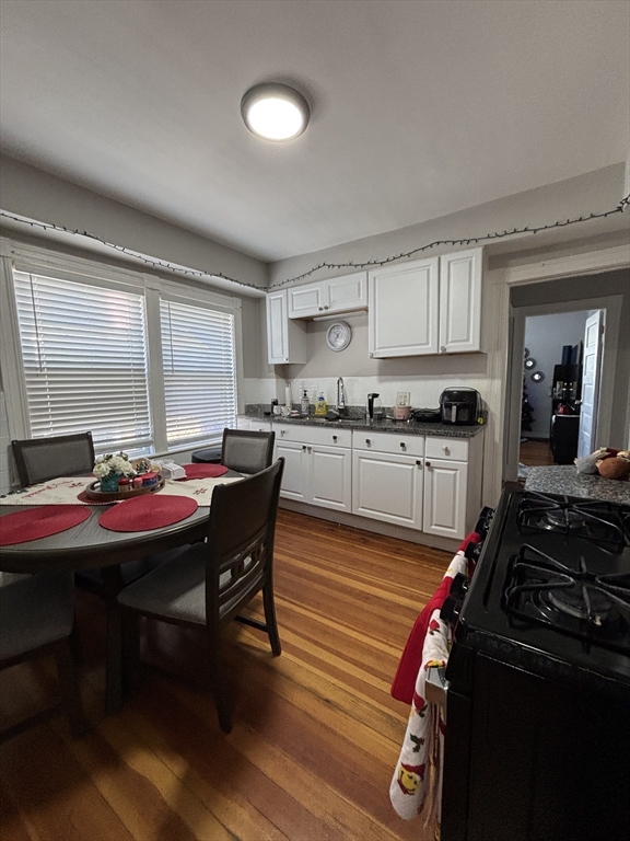a kitchen with a stove and a refrigerator