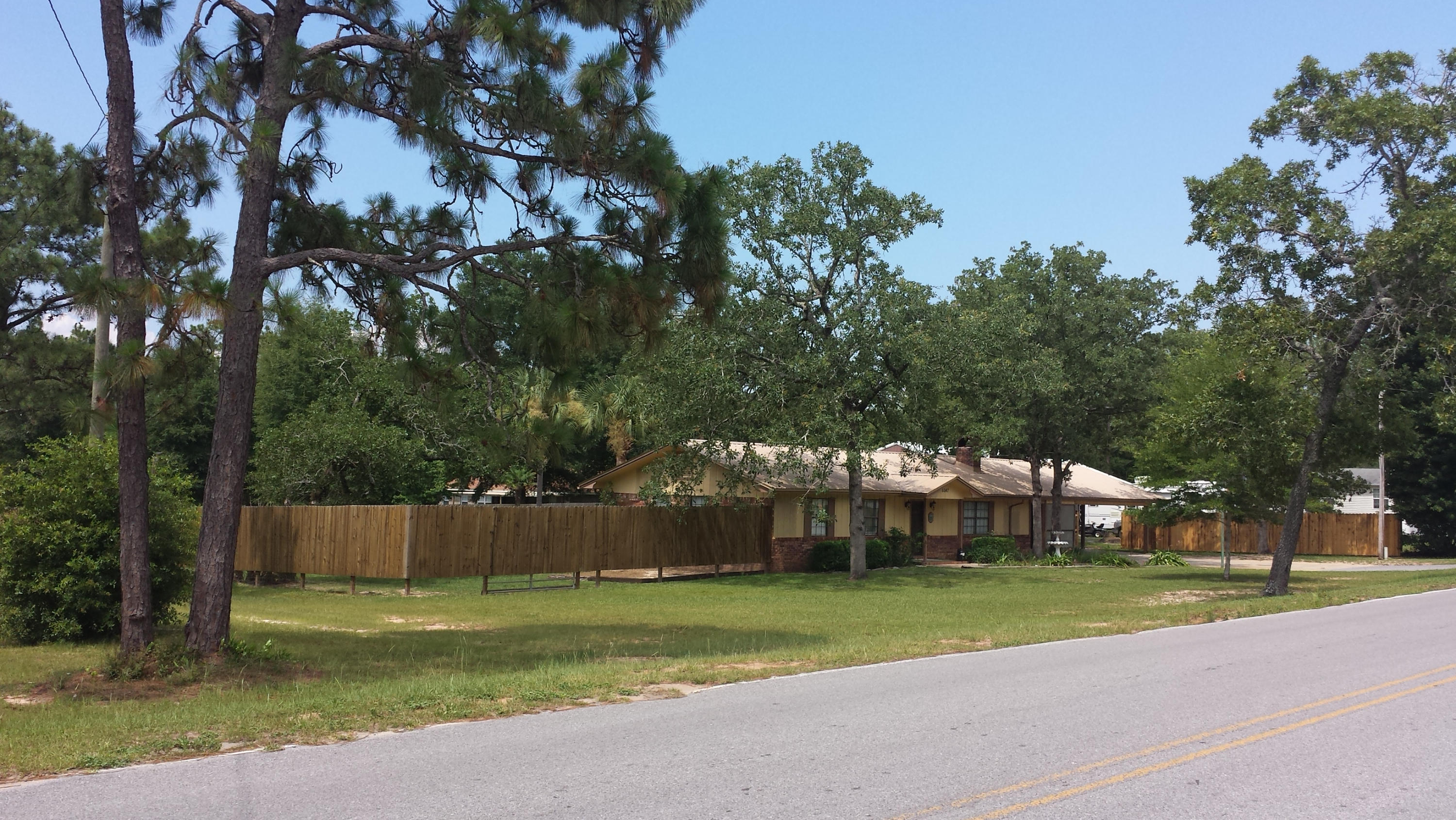 6047 Eden Square Crestview, FL 32539 - Photo 1 of 22 a view of a park with large trees