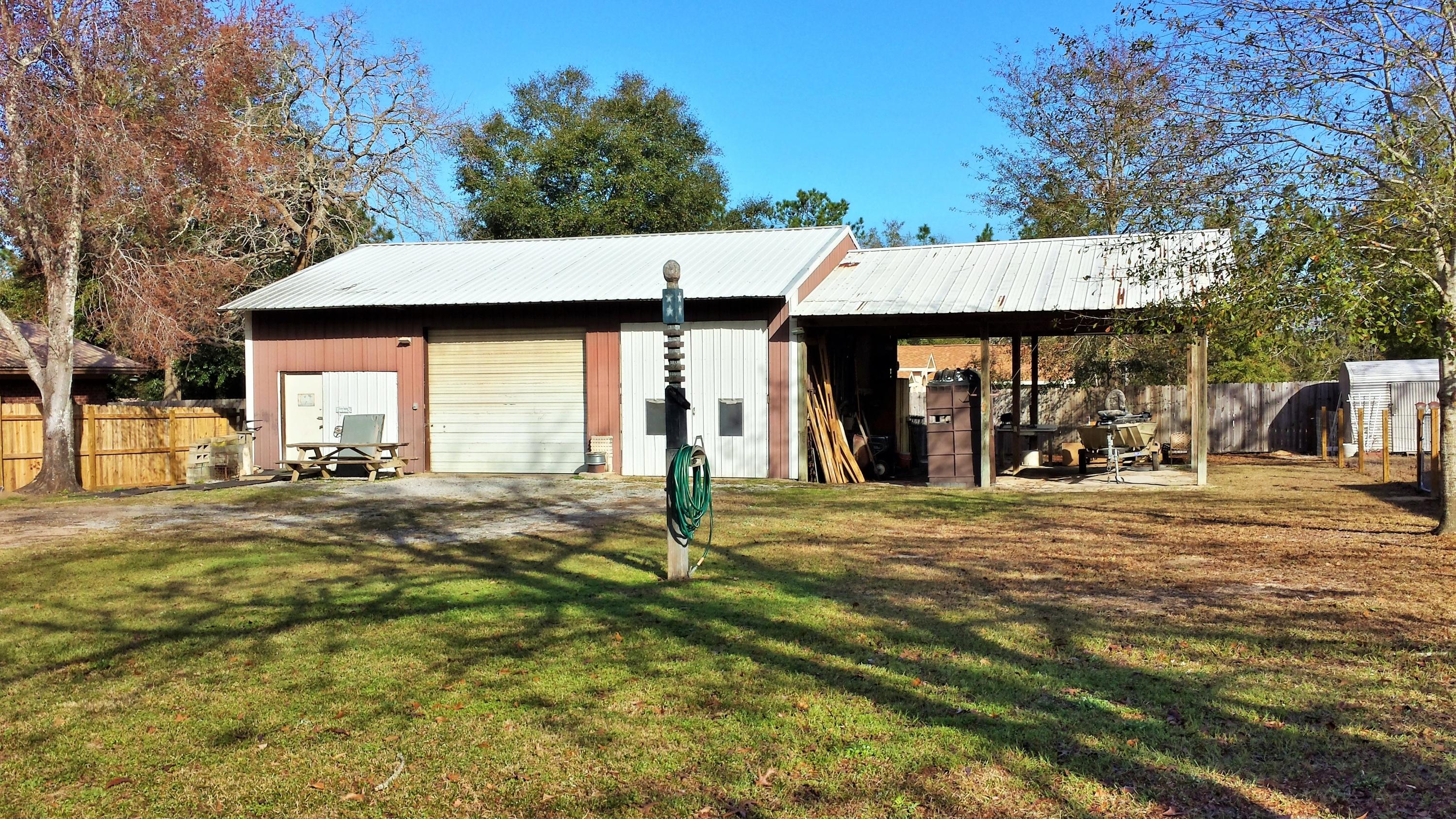 6047 Eden Square Crestview, FL 32539 - Photo 19 of 22 a front view of a house with a yard