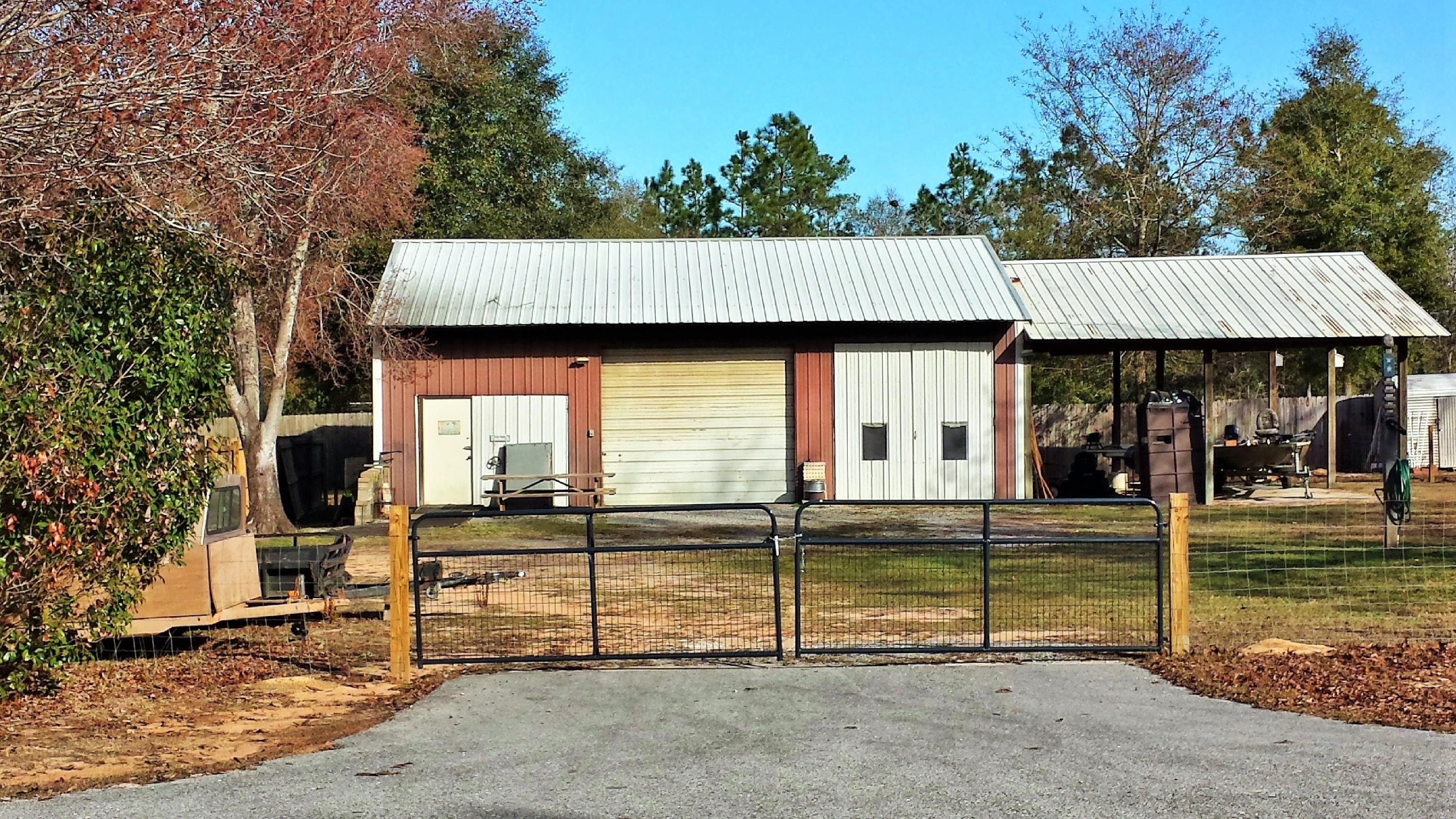 6047 Eden Square Crestview, FL 32539 - Photo 20 of 22 a view of a house with backyard and porch