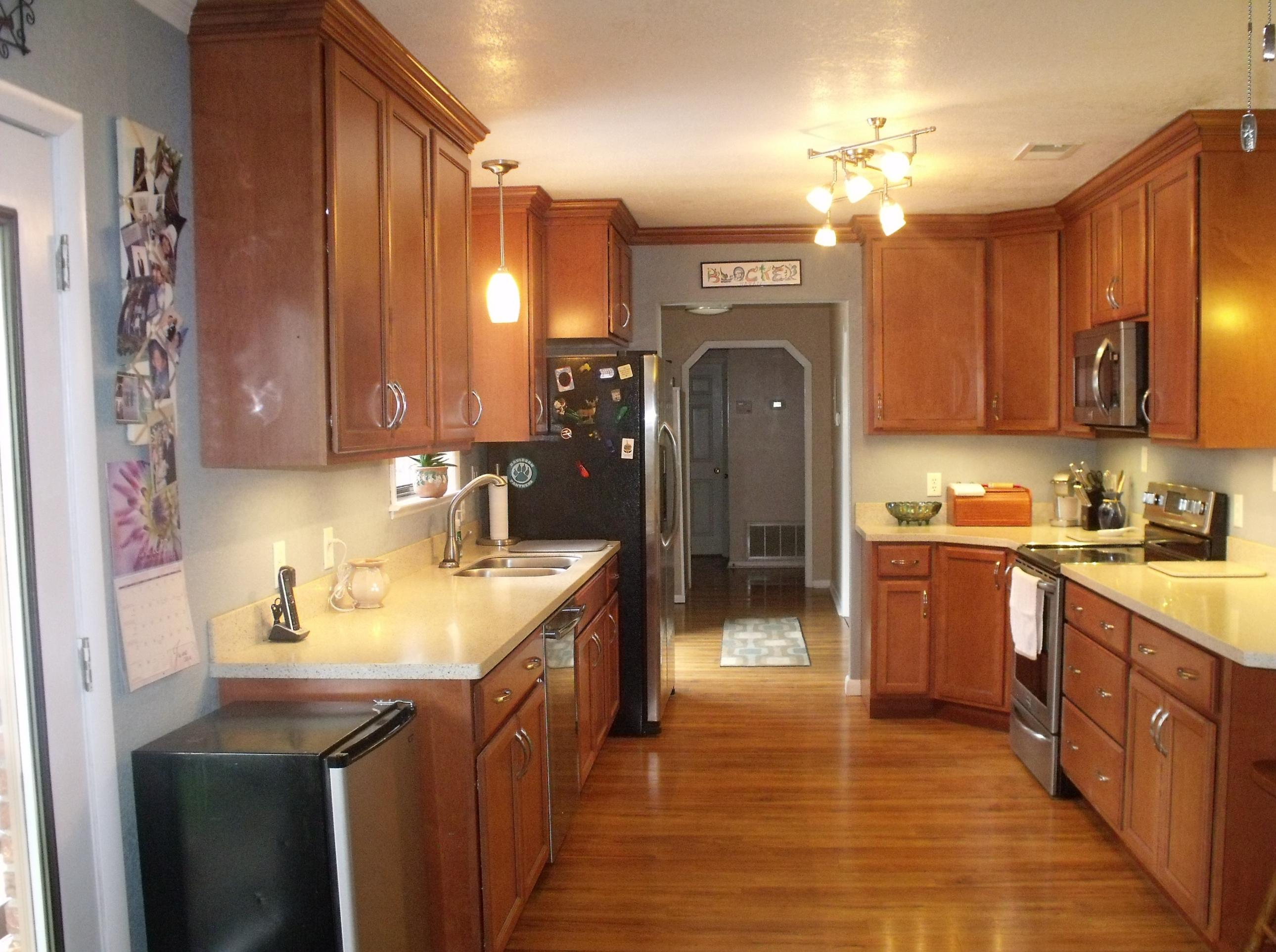 6047 Eden Square Crestview, FL 32539 - Photo 4 of 22 a kitchen with a sink cabinets and appliances