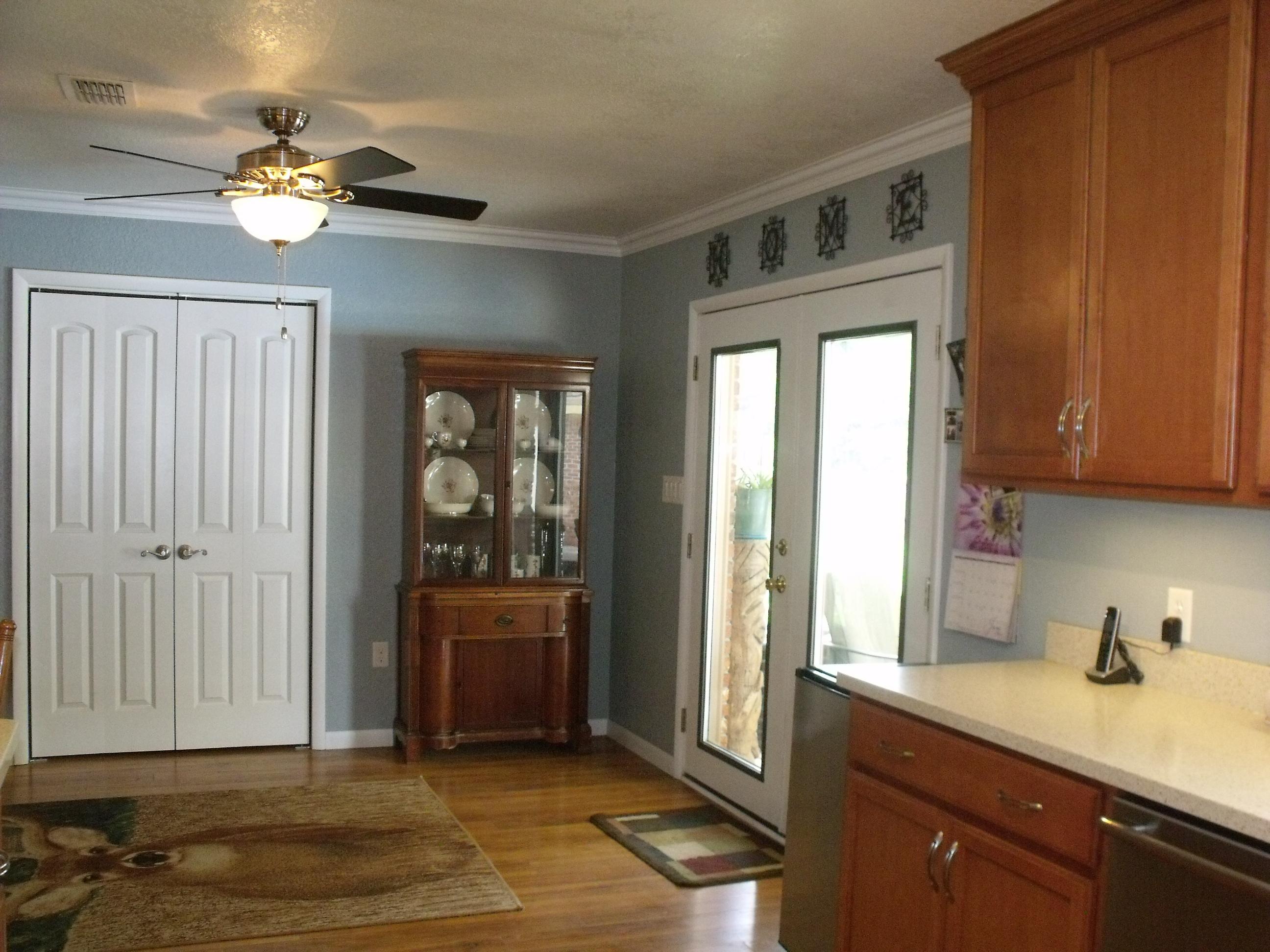 6047 Eden Square Crestview, FL 32539 - Photo 6 of 22 a view of a kitchen with a sink dishwasher and cabinet with wooden floor