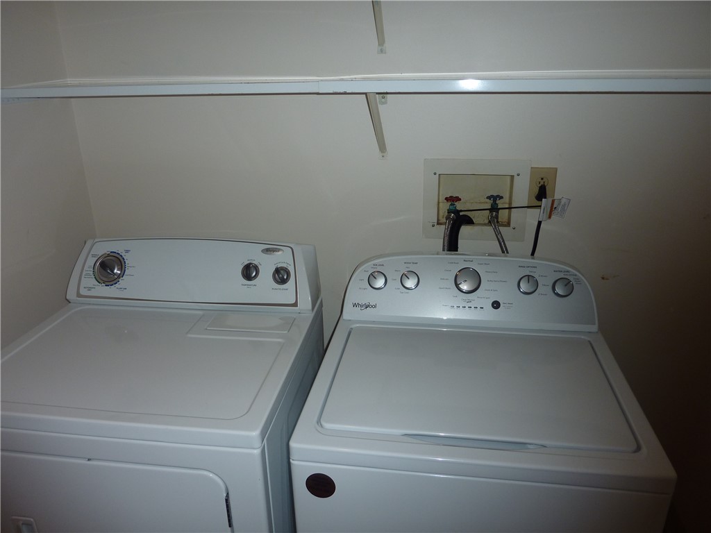 1345 Tattersall Road, Unit 64 Dayton, OH 45459 - Photo 22 of 25 This dedicated laundry space offers convenience with essential appliances readily available for daily tasks.