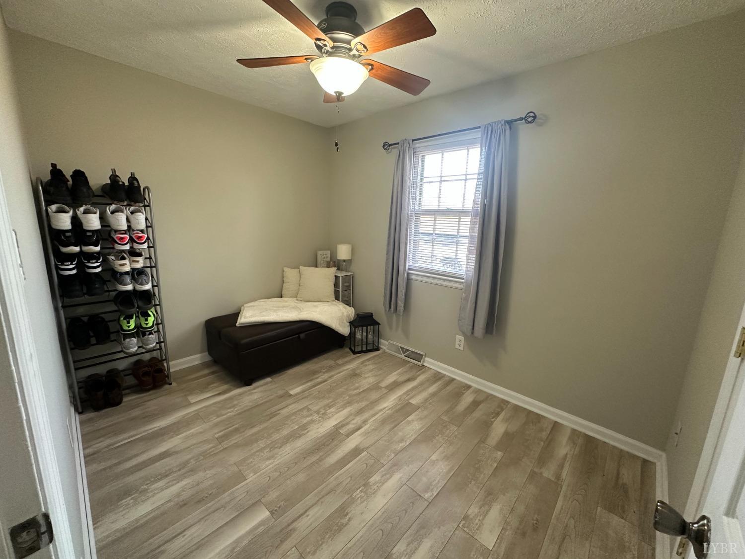 428 Thomas Road Madison Heights, VA 24572 - Photo 8 of 10 a bedroom with a bed and a window