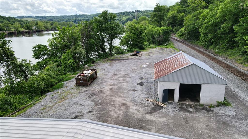 736 Front Street Fredericktown, PA 15333 - Photo 13 of 41 a front view of a house with a yard and garage