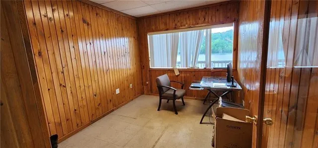 a view of a room with furniture and window