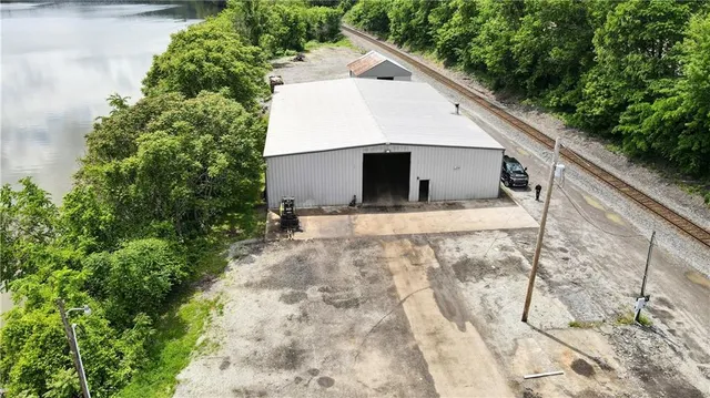 a white house with tree in the background