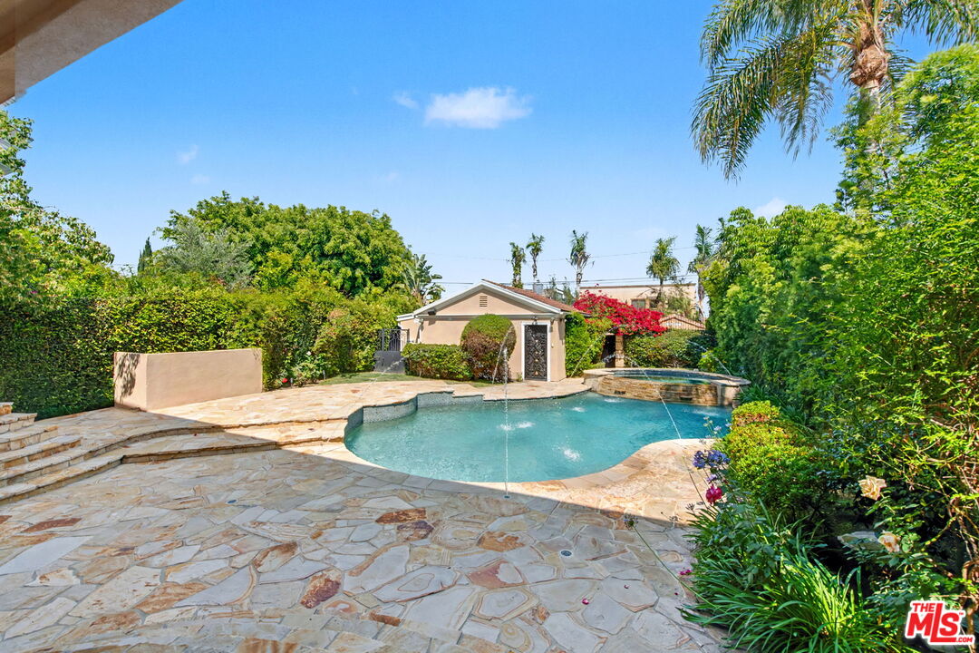 204 Foothill Road Beverly Hills, CA 90210 - Photo 30 of 38 a view of a swimming pool with a patio