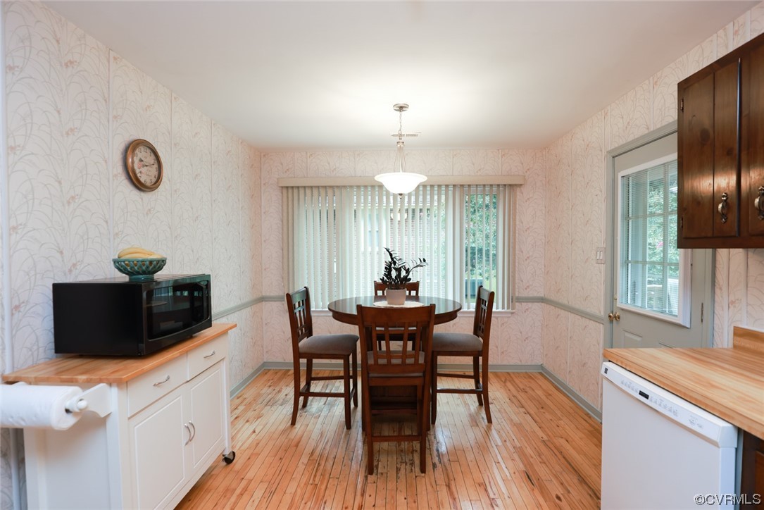 5036 Rollingway Road Chesterfield, VA 23832 - Photo 18 of 42 a view of a dining room with furniture and wooden floor