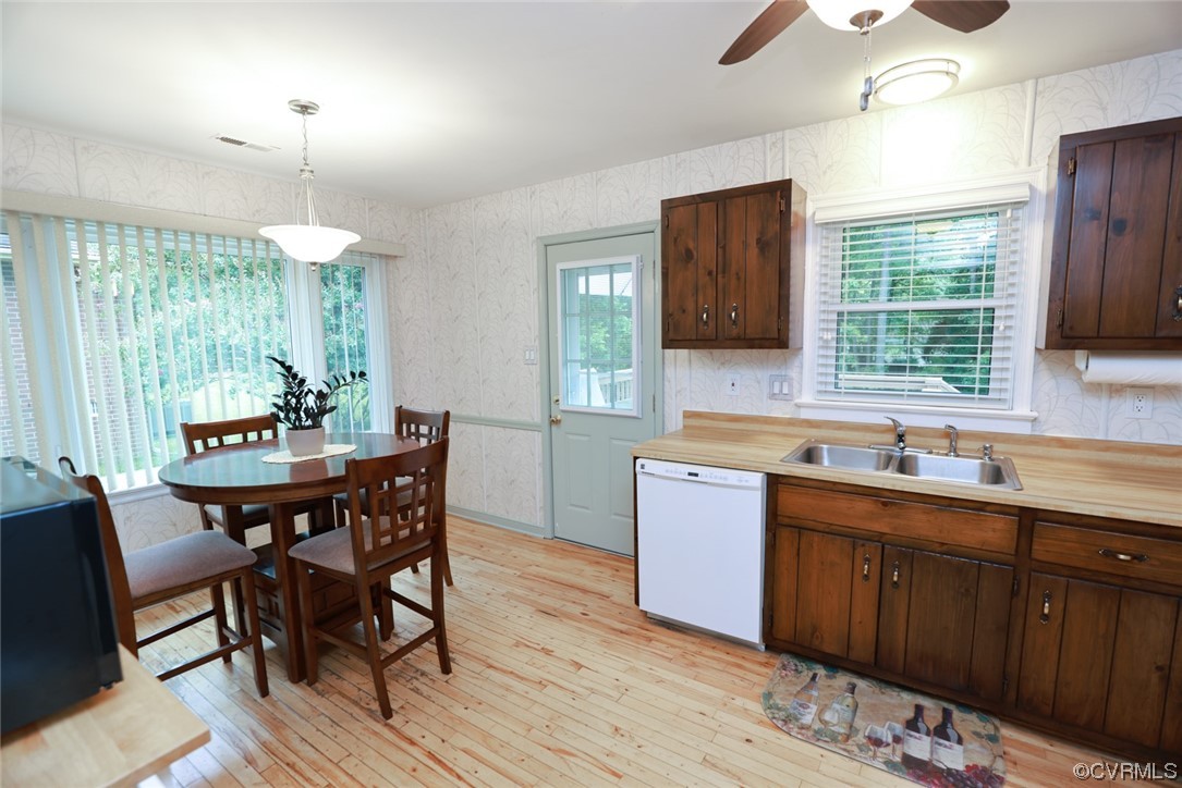 5036 Rollingway Road Chesterfield, VA 23832 - Photo 25 of 42 a kitchen with a wooden table chairs and a window
