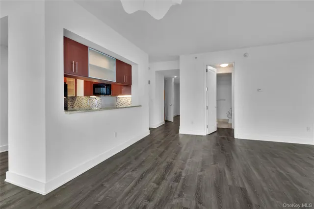 a view of a kitchen cabinets and wooden floor