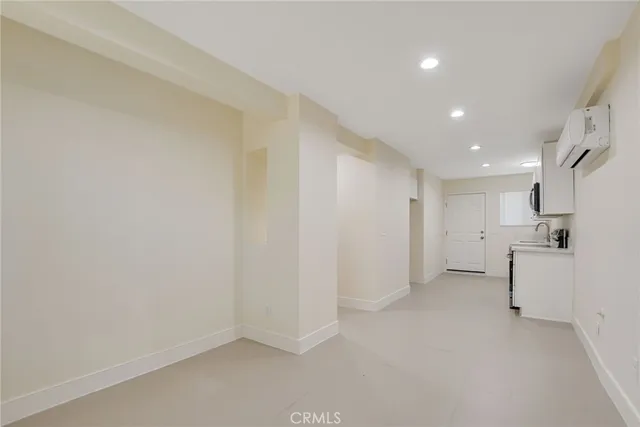 a view of a livingroom and a kitchen