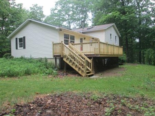 266 Pommogussett Road Rutland, MA 01543 - Photo 5 of 13 a view of house with a yard and deck area
