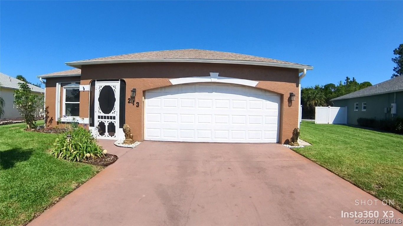213 Falcon Avenue Edgewater, FL 32141 - Photo 1 of 44 a front view of a house with a yard