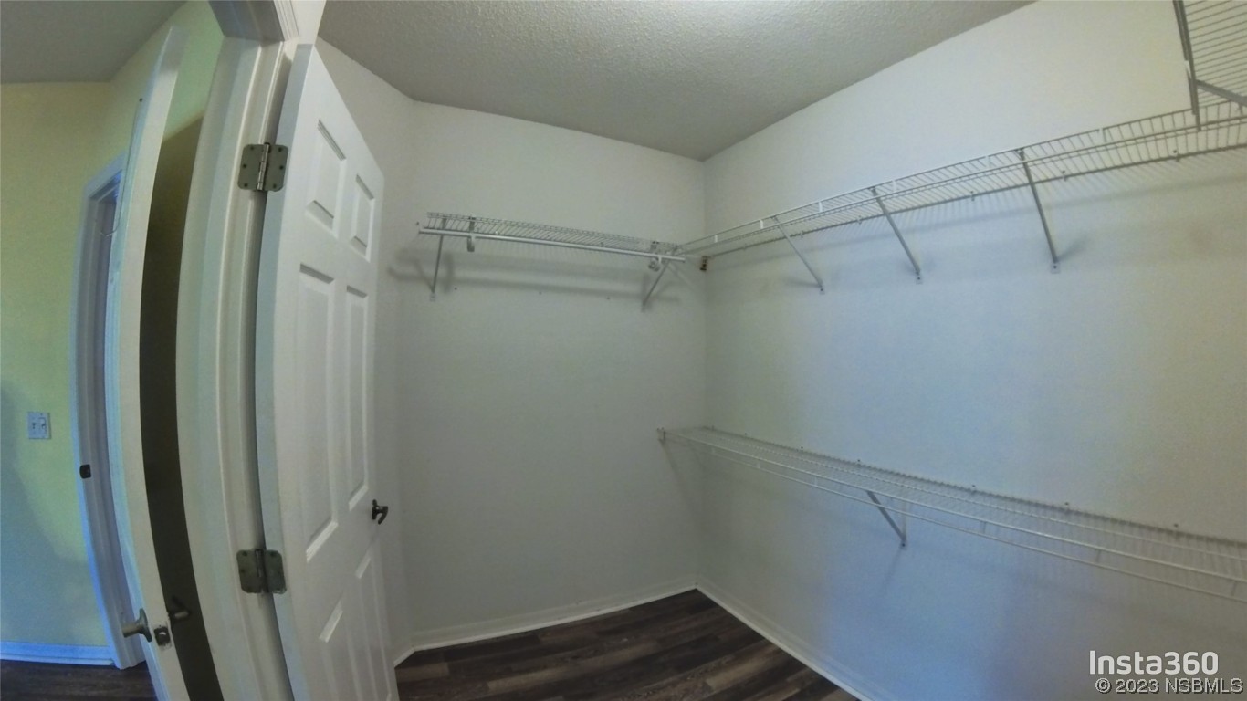 213 Falcon Avenue Edgewater, FL 32141 - Photo 18 of 44 a view of a room with racks on the wall