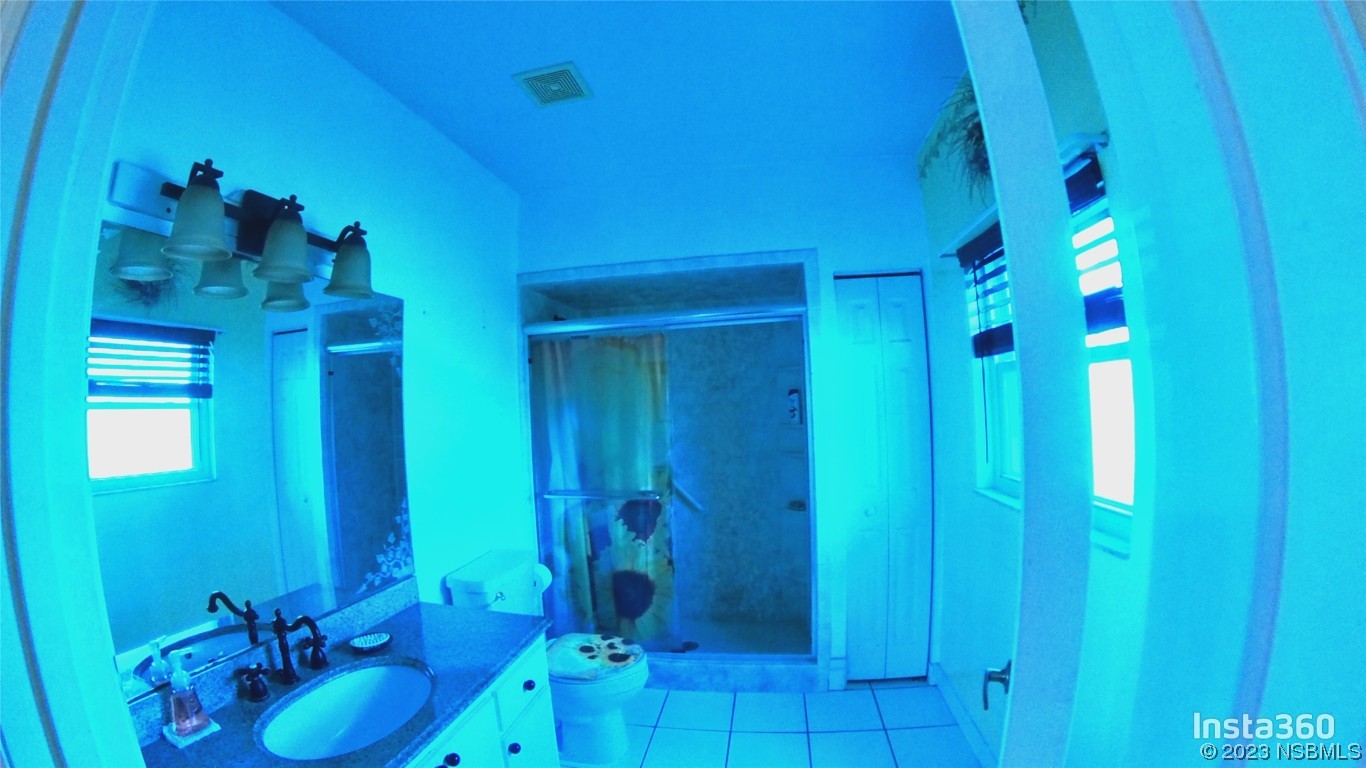 213 Falcon Avenue Edgewater, FL 32141 - Photo 20 of 44 a bathroom with a sink shower and a mirror