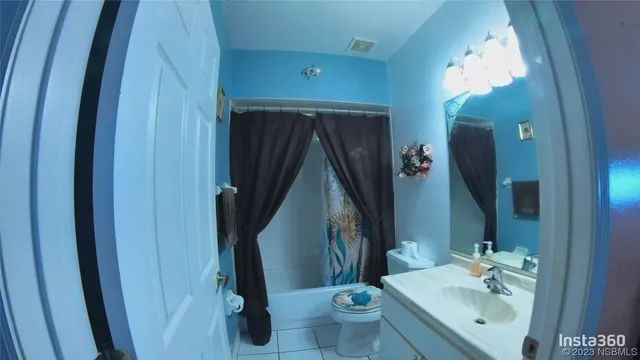 a bathroom with a sink a toilet and vanity