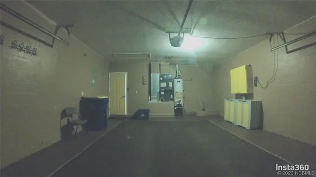 a view of a room with furniture and windows