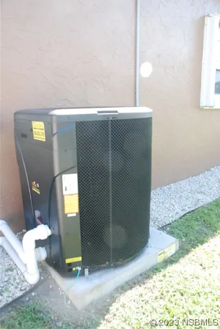 a swimming pool with some trees in the background