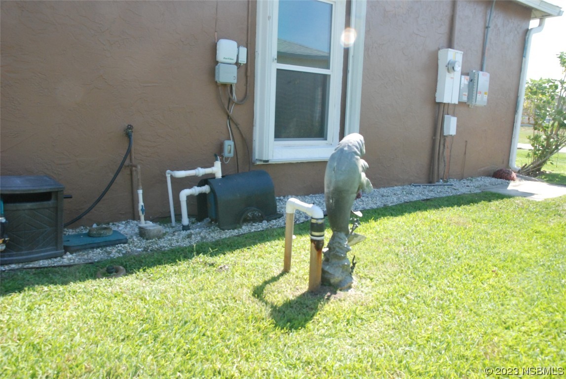 213 Falcon Avenue Edgewater, FL 32141 - Photo 40 of 44 a swimming pool with some trees in the background