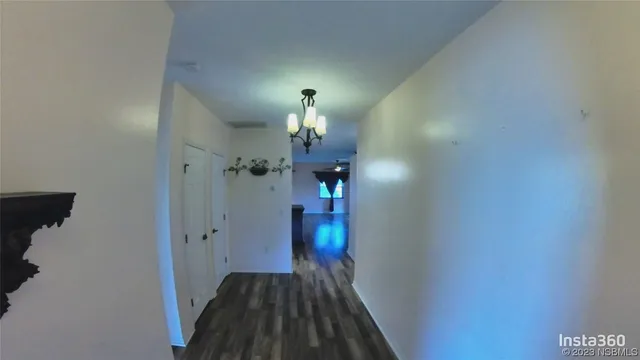 a view of a livingroom from a hallway