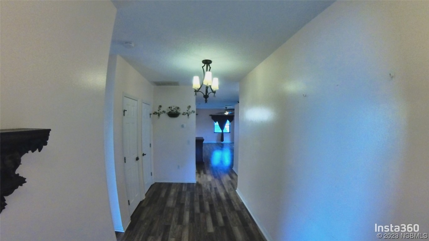 213 Falcon Avenue Edgewater, FL 32141 - Photo 5 of 44 a view of a livingroom from a hallway
