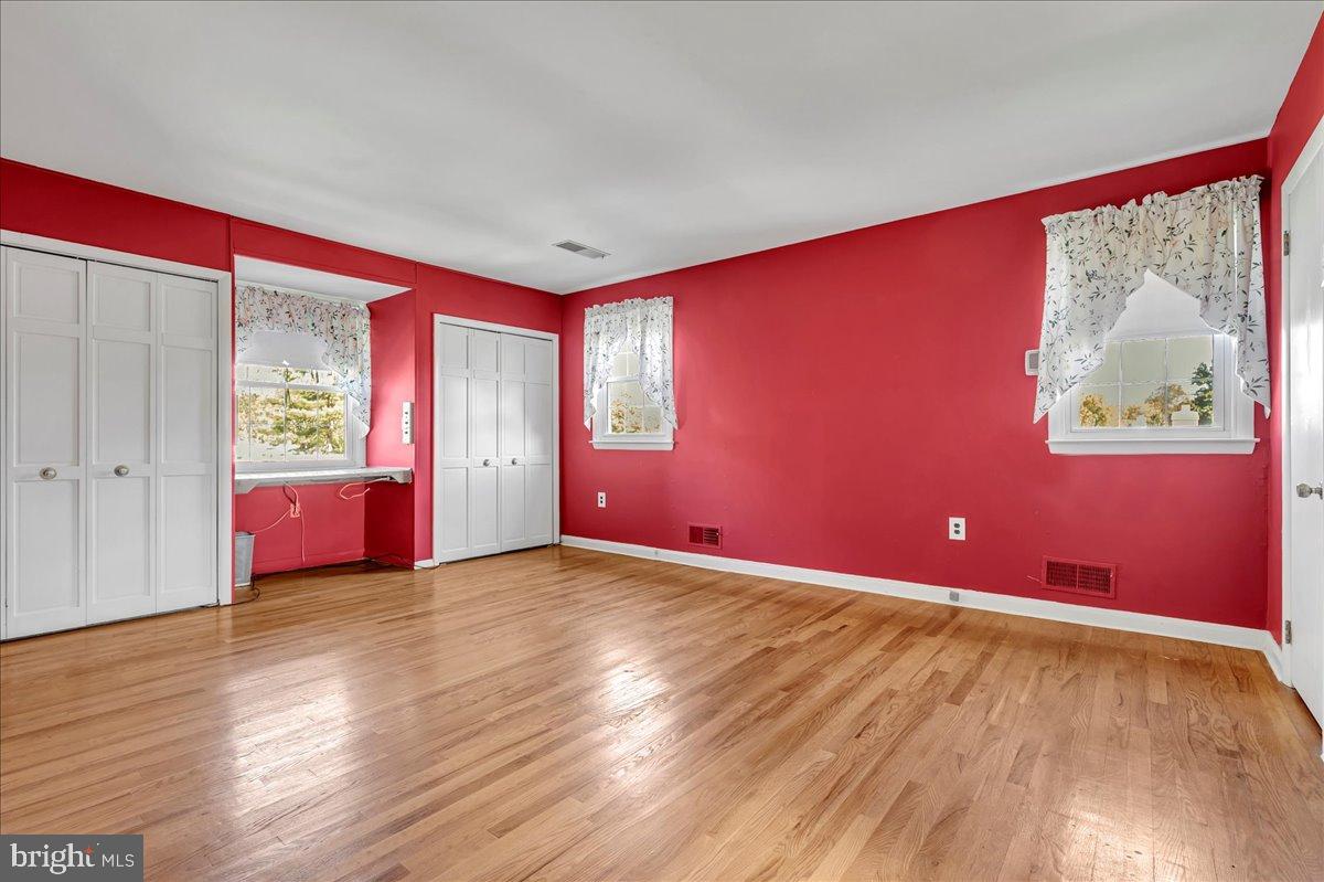 2010 Kynwyd Road Wilmington, DE 19810 - Photo 18 of 33 a view of an empty room with window and wooden floor
