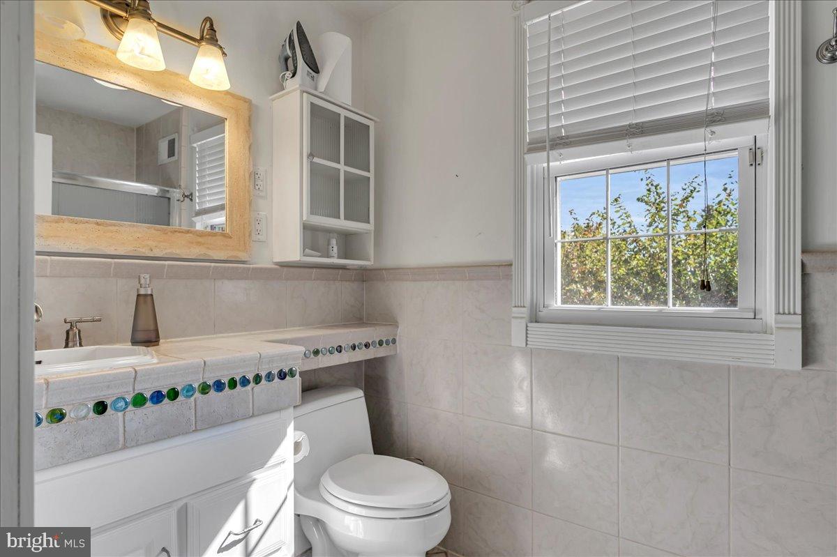 2010 Kynwyd Road Wilmington, DE 19810 - Photo 24 of 33 a white toilet sitting next to a bathroom sink