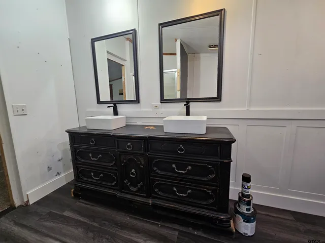 a bathroom with a glass shower door