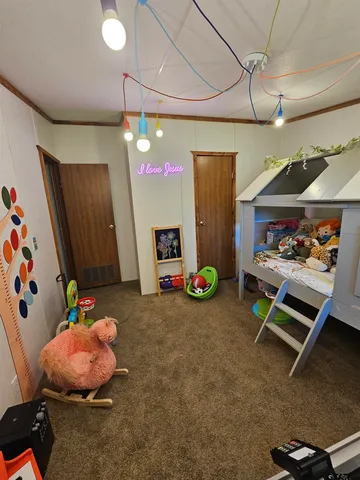 a bedroom with a bed closet and a window