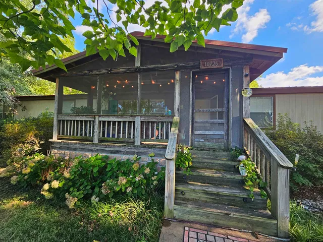 a view of a house with brick walls