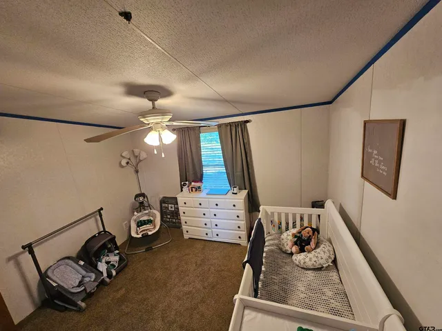 a bedroom with furniture and a bed