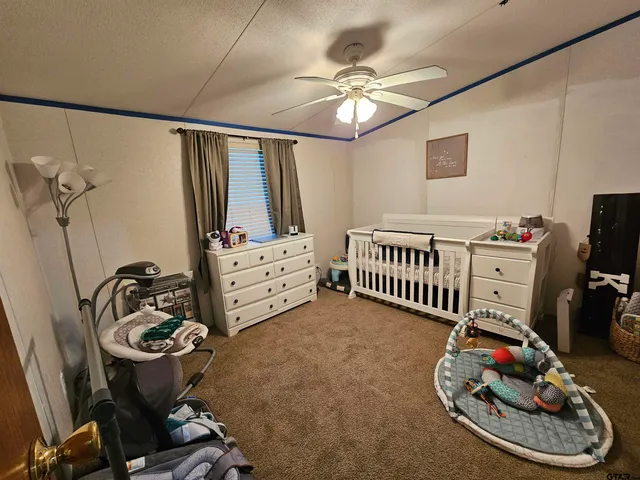 a view of living room with furniture and a window