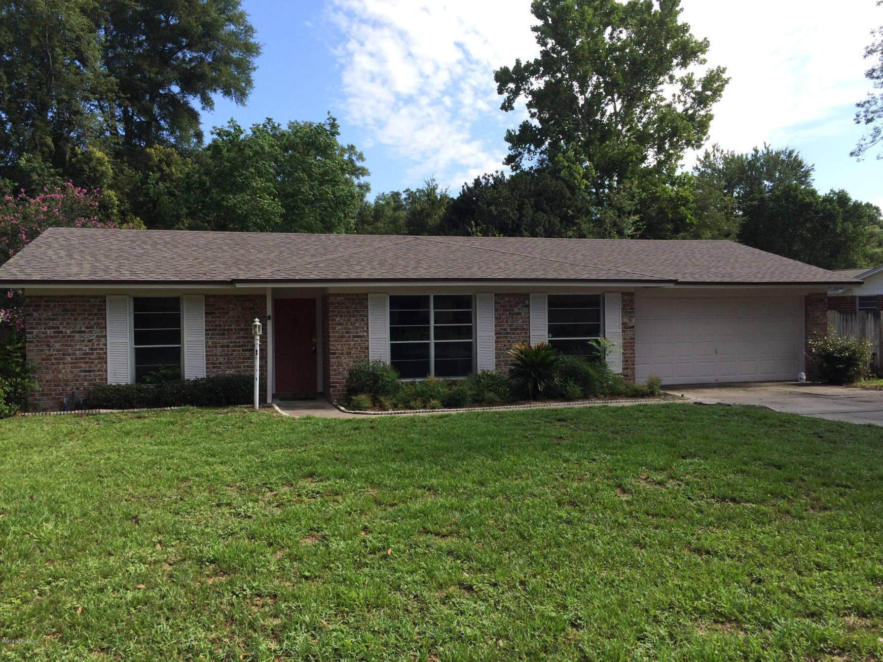 5471 Weaver Road Orange Park, FL 32073 - Photo 3 of 22 a front view of a house with a garden