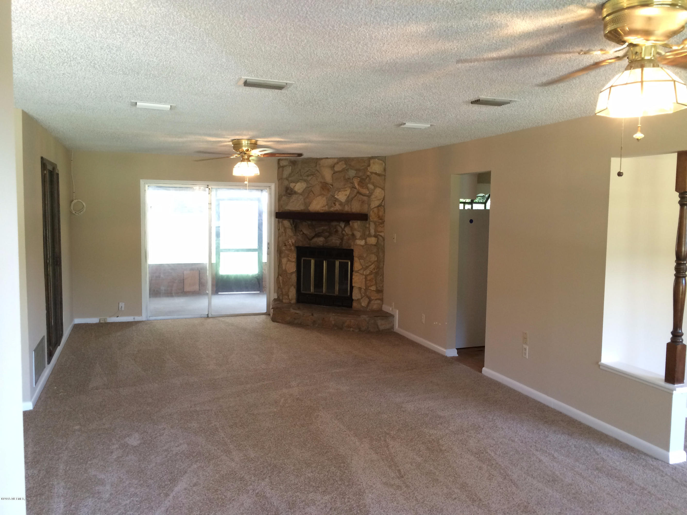 5471 Weaver Road Orange Park, FL 32073 - Photo 7 of 22 a view of a livingroom with a fireplace