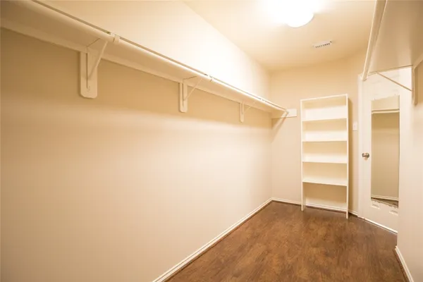 a view of an empty walk in closet