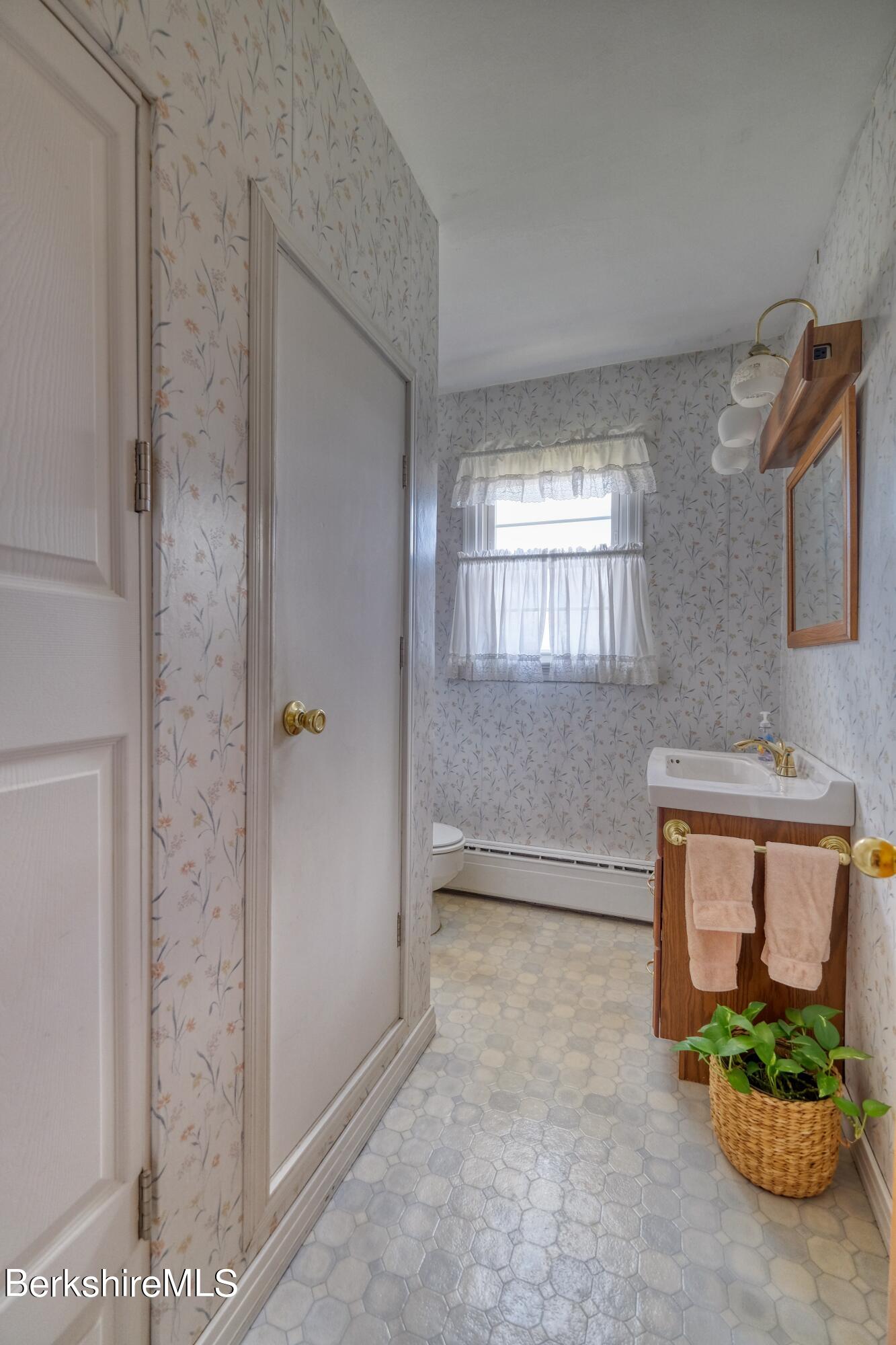 237 Eleanor Road Pittsfield, MA 01201 - Photo 11 of 30 a bathroom with a sink and a mirror