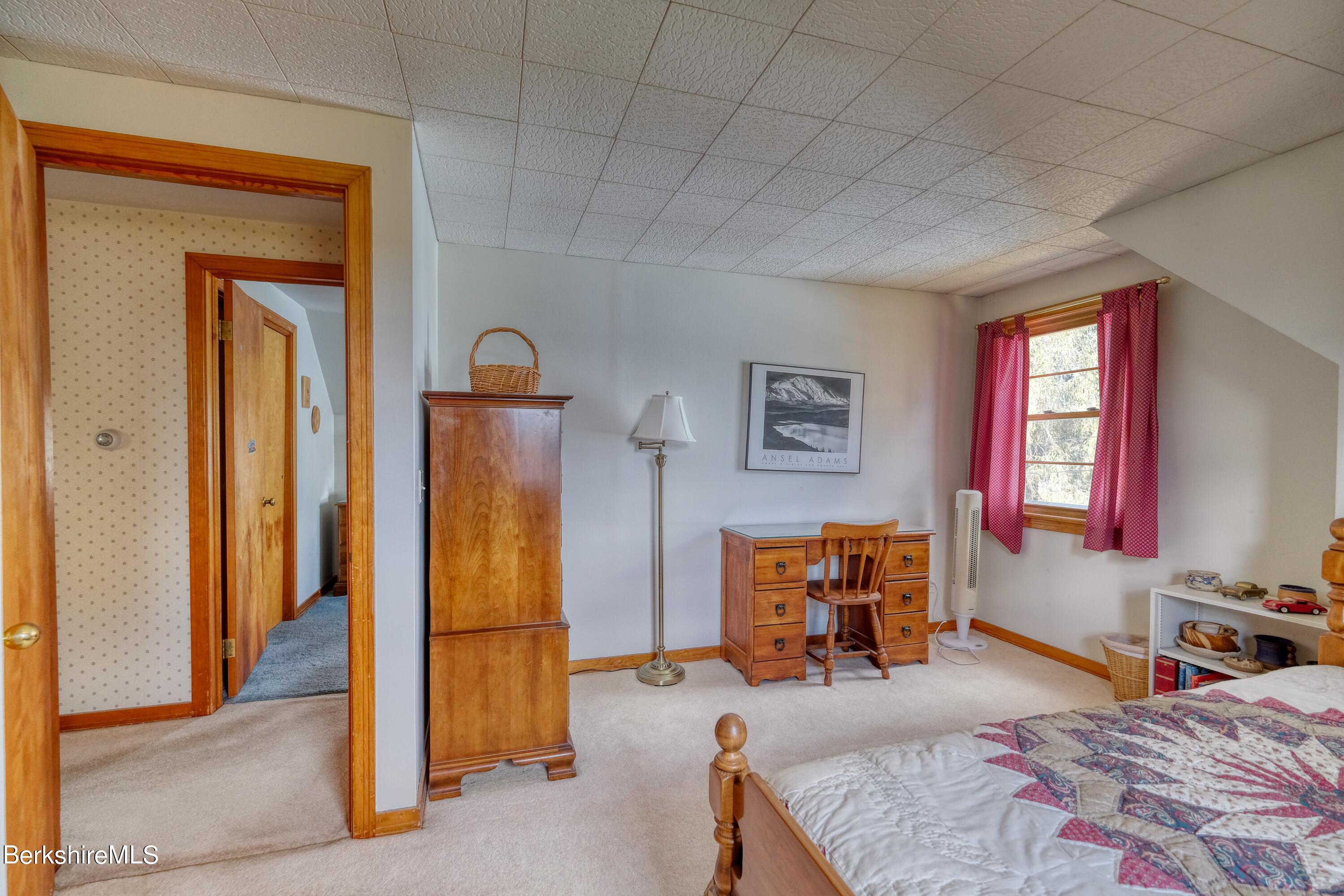 237 Eleanor Road Pittsfield, MA 01201 - Photo 20 of 30 a bedroom with a bed and wooden floor