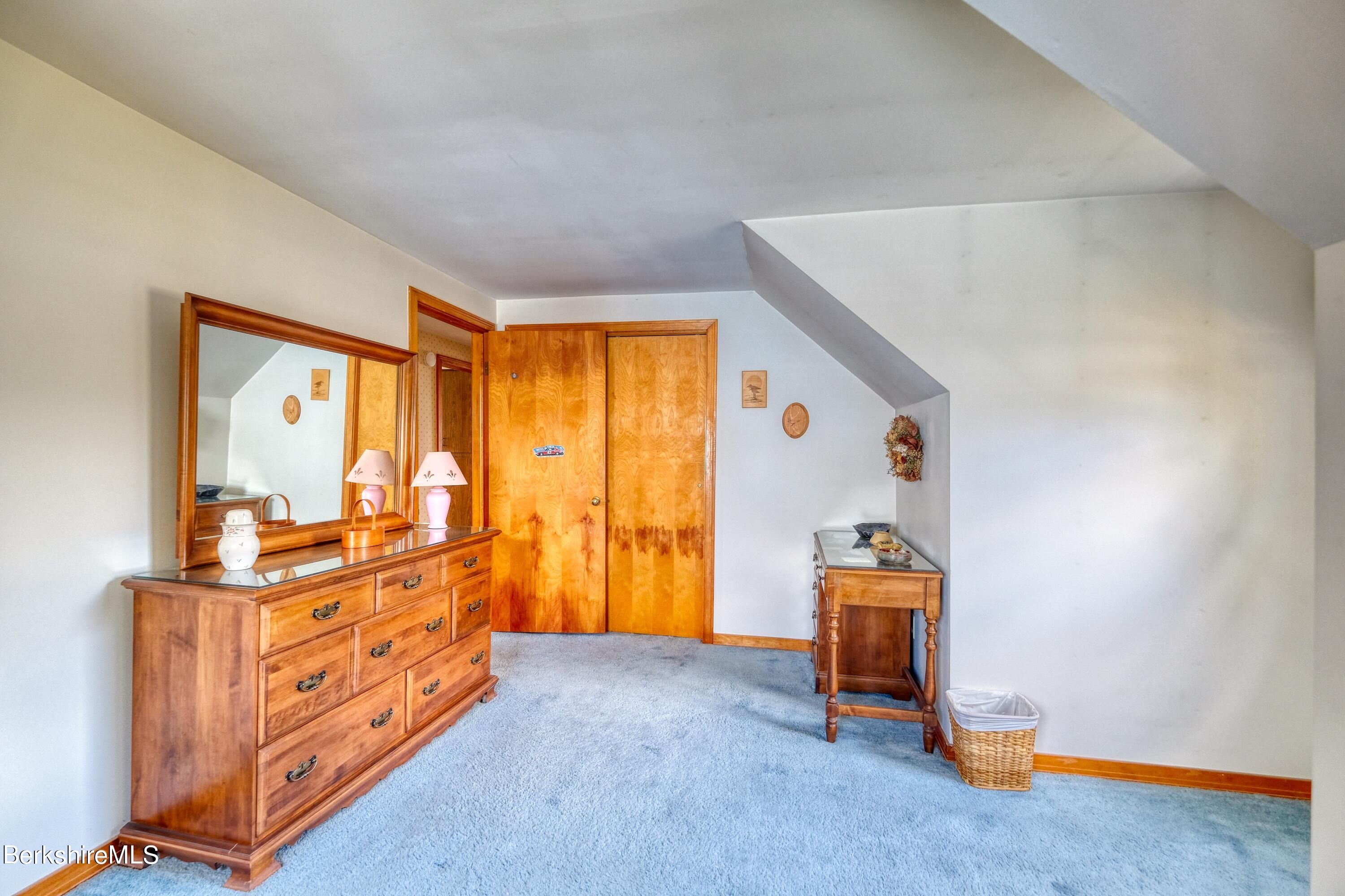 237 Eleanor Road Pittsfield, MA 01201 - Photo 22 of 30 a bedroom with a window and gym equipment