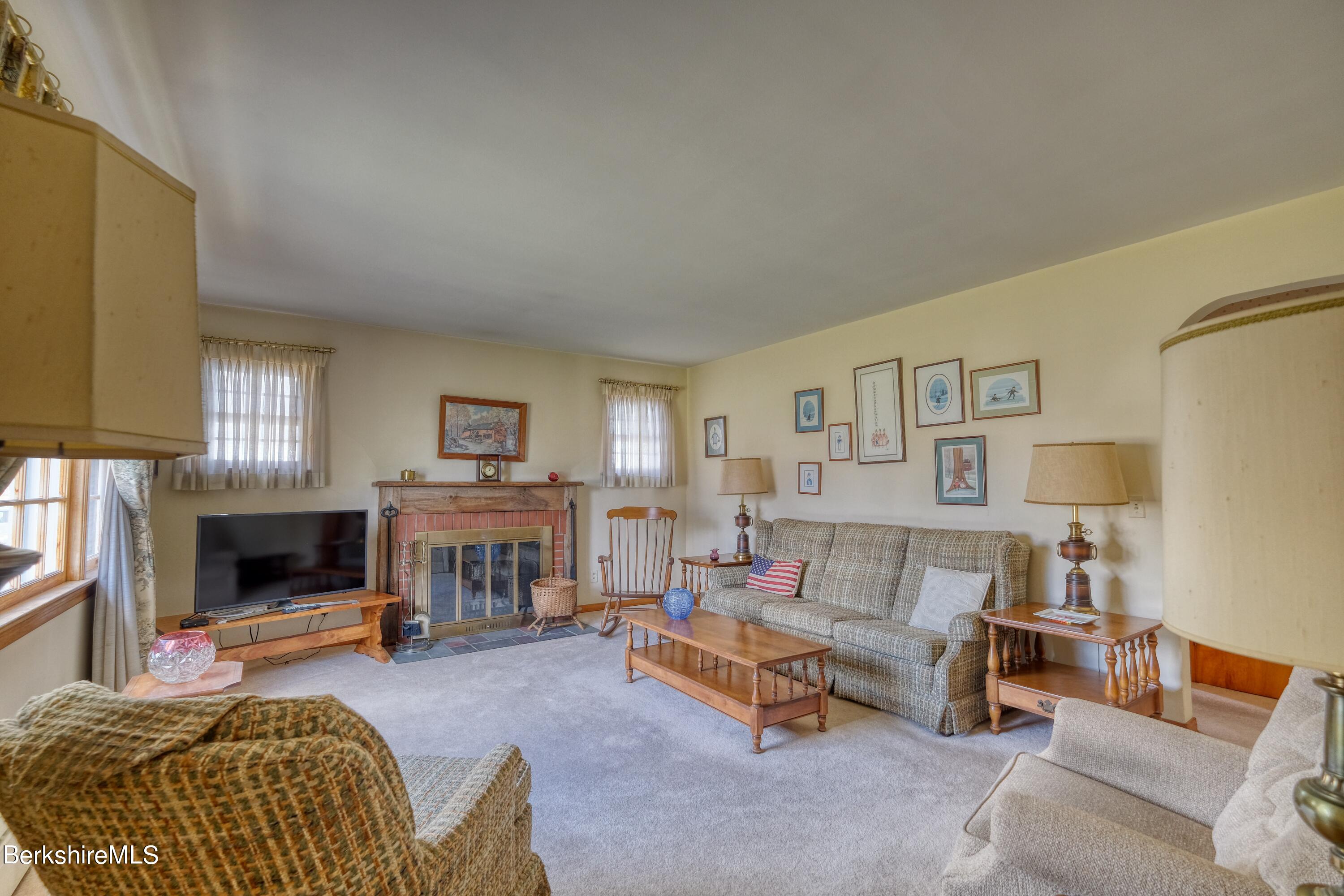 237 Eleanor Road Pittsfield, MA 01201 - Photo 4 of 30 a living room with furniture and a fireplace