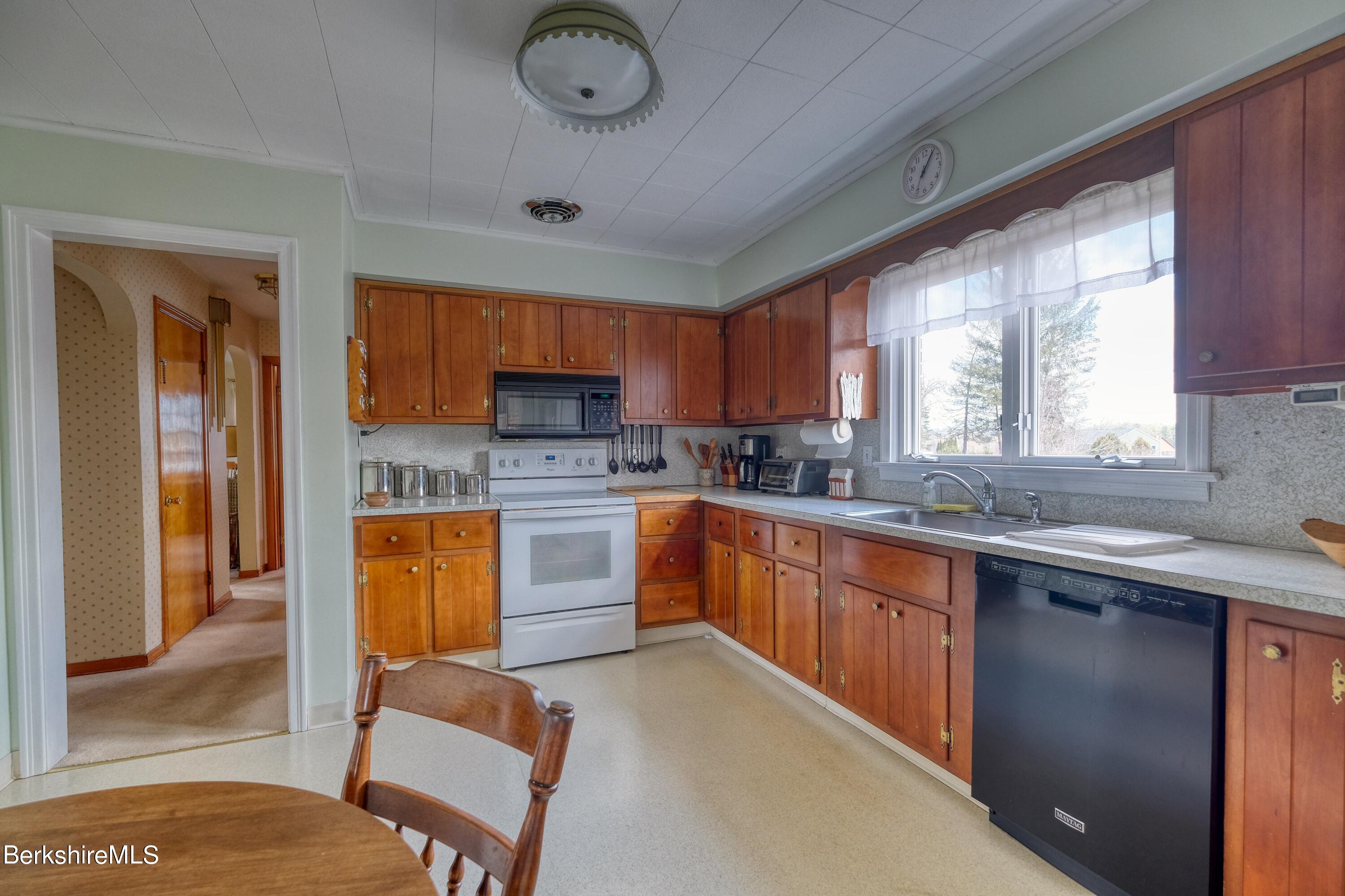 237 Eleanor Road Pittsfield, MA 01201 - Photo 9 of 30 a kitchen with stainless steel appliances granite countertop a sink dishwasher stove and refrigerator