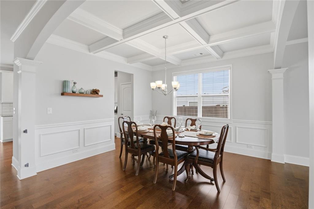 619 Little Bear Loop Canton, GA 30114 - Photo 12 of 39 a view of a dining room with furniture and wooden floor