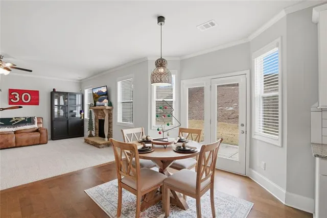 a view of a livingroom with furniture and a ceiling fan