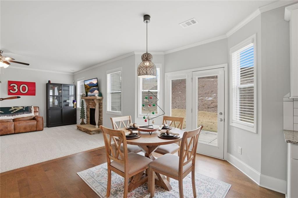 619 Little Bear Loop Canton, GA 30114 - Photo 15 of 39 a dining room with furniture and window