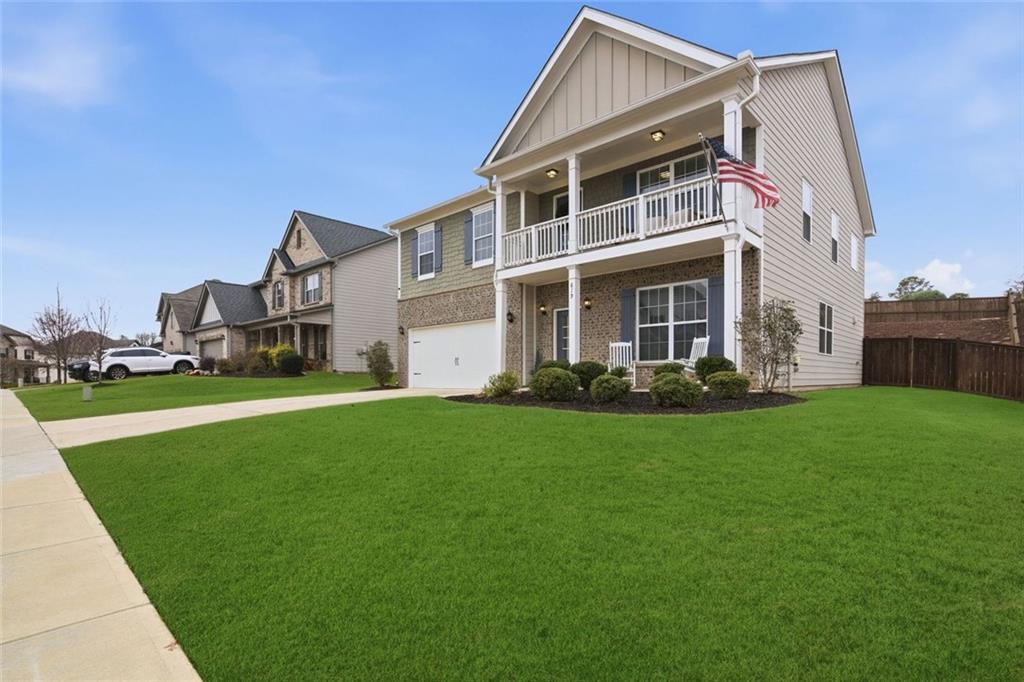 619 Little Bear Loop Canton, GA 30114 - Photo 2 of 39 a front view of house with yard