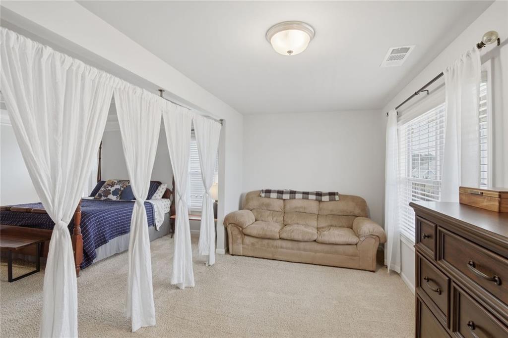 619 Little Bear Loop Canton, GA 30114 - Photo 21 of 39 a living room with furniture and a window