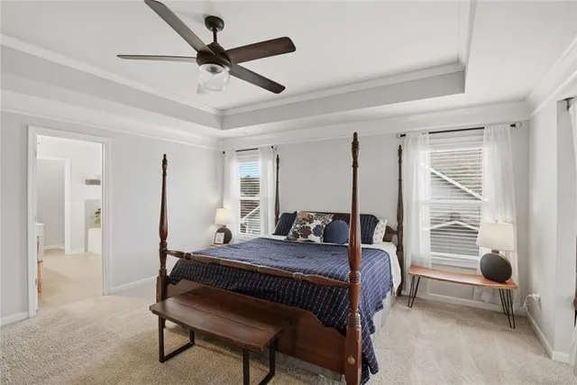 a en suite bathroom with a double vanity sink and a mirror