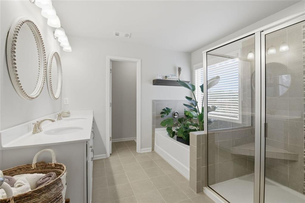 619 Little Bear Loop Canton, GA 30114 - Photo 25 of 39 a bathroom with a sink and a mirror