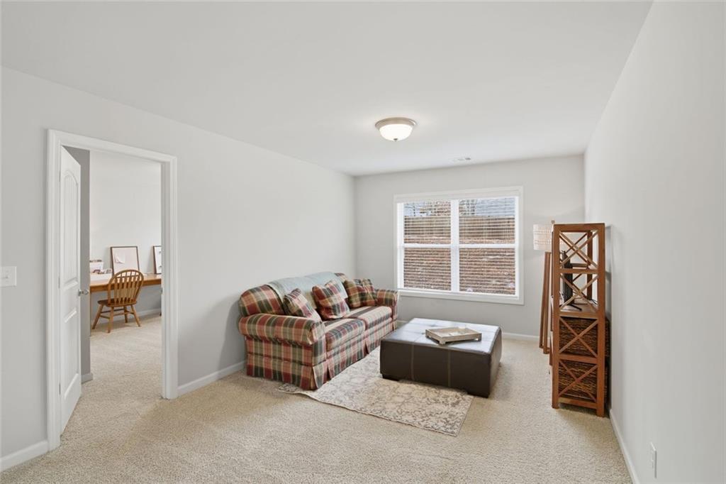 619 Little Bear Loop Canton, GA 30114 - Photo 27 of 39 a living room with furniture and a window