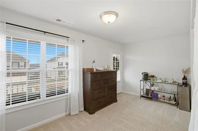 a bedroom with a bed and a table